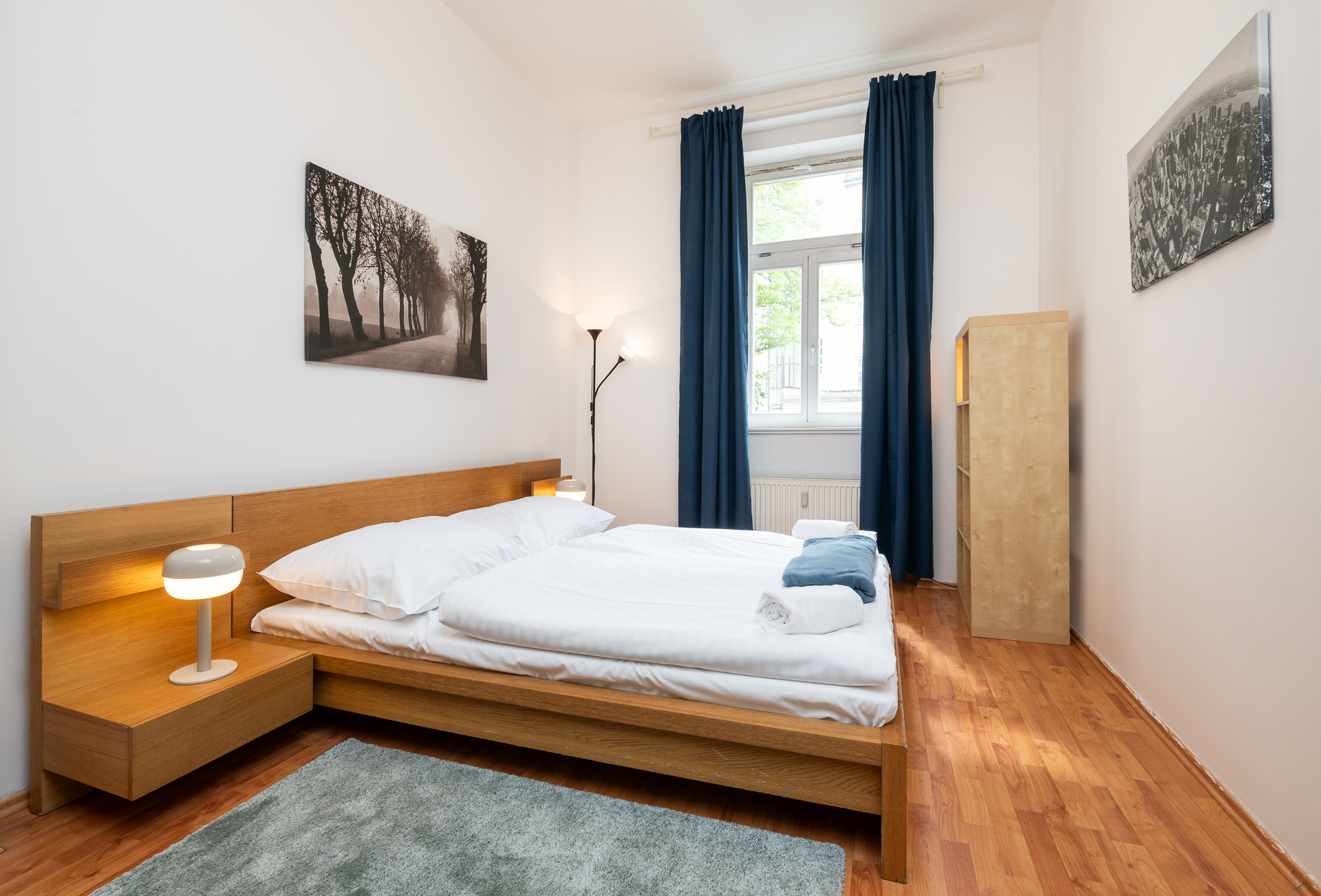 Bright Letna71 bedroom with oak bed and warm bedside light